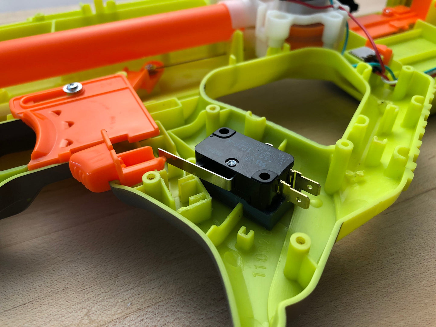 Nerf Rayven Switch mounting plate 3d printed (Ideal rev trigger switch placement)
